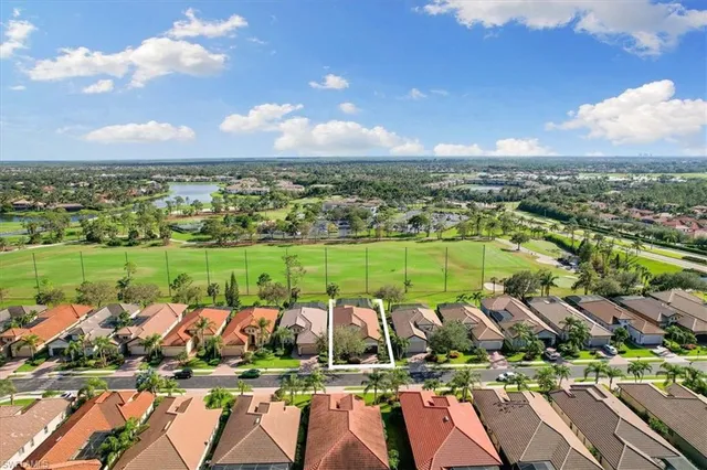 an aerial view of a houses with a lake view