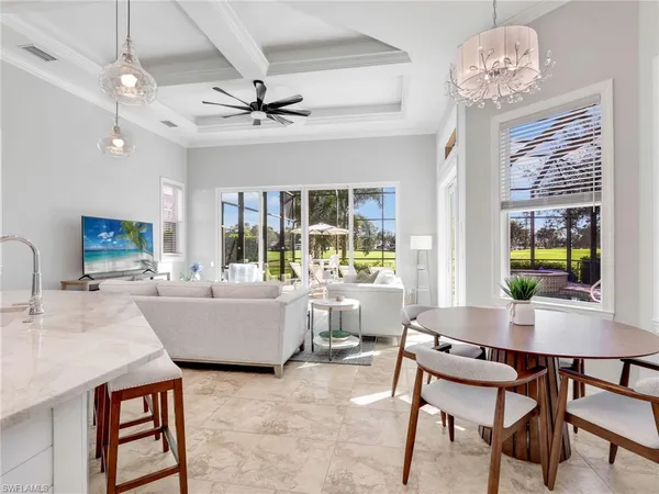 a living room with furniture and a large glass table