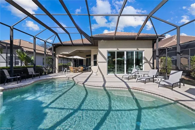 a view of a backyard with sitting area