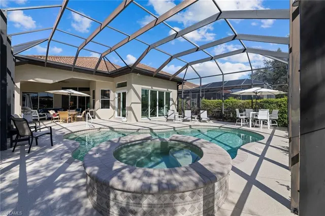 a view of a swimming pool with a patio