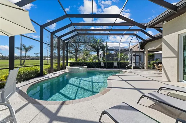 a view of a backyard with sitting area