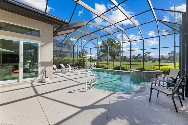 a view of a swimming pool with a patio