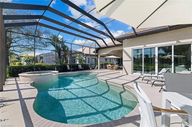 a view of a swimming pool with a patio