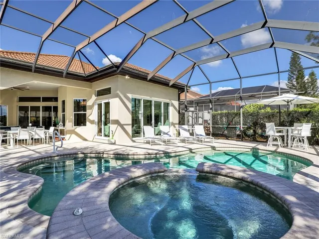 a view of a swimming pool with a patio