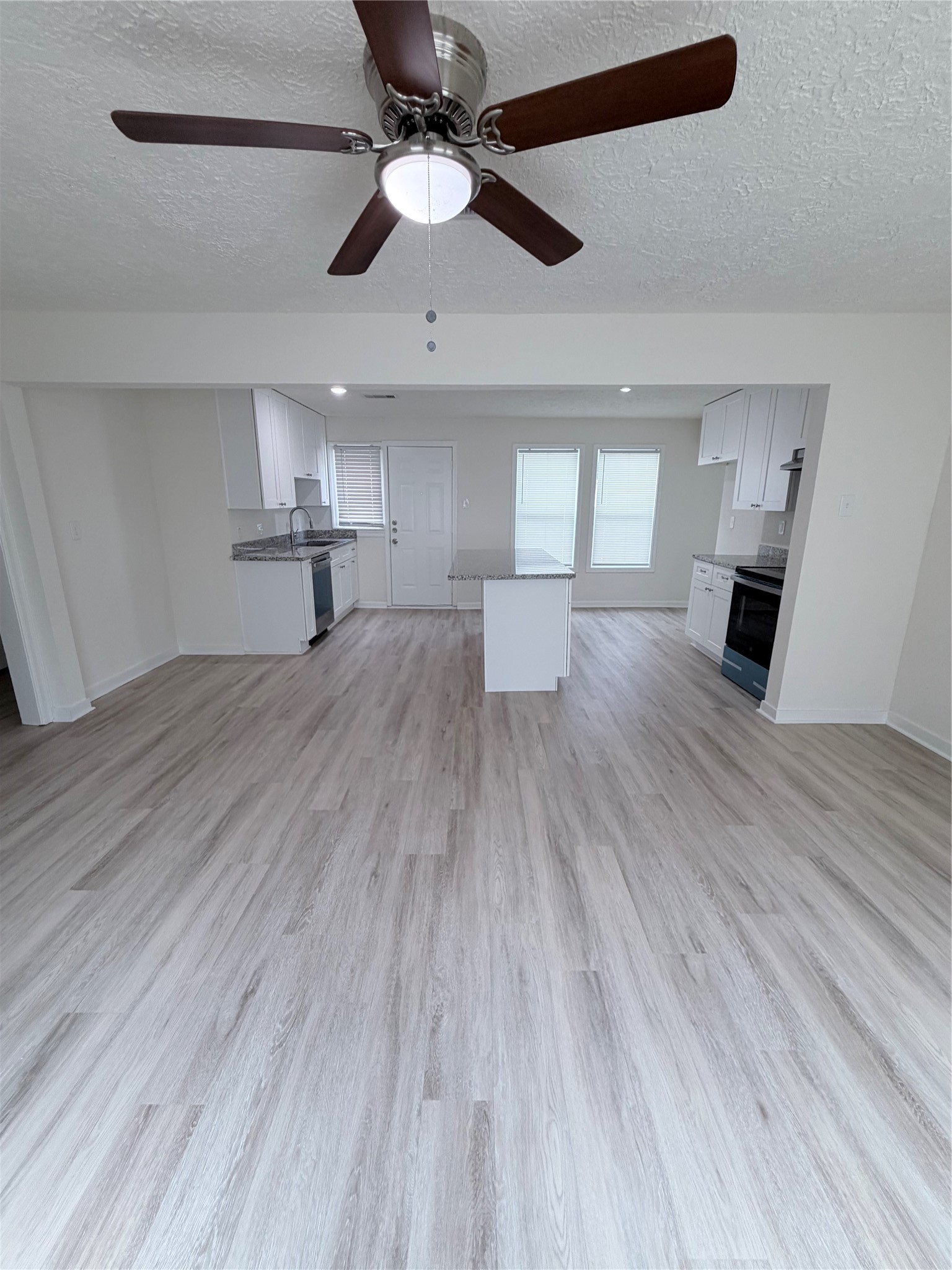 1112 3rd Street La Marque, TX 77568 - Photo 11 of 21 a living room with furniture and a wooden floor