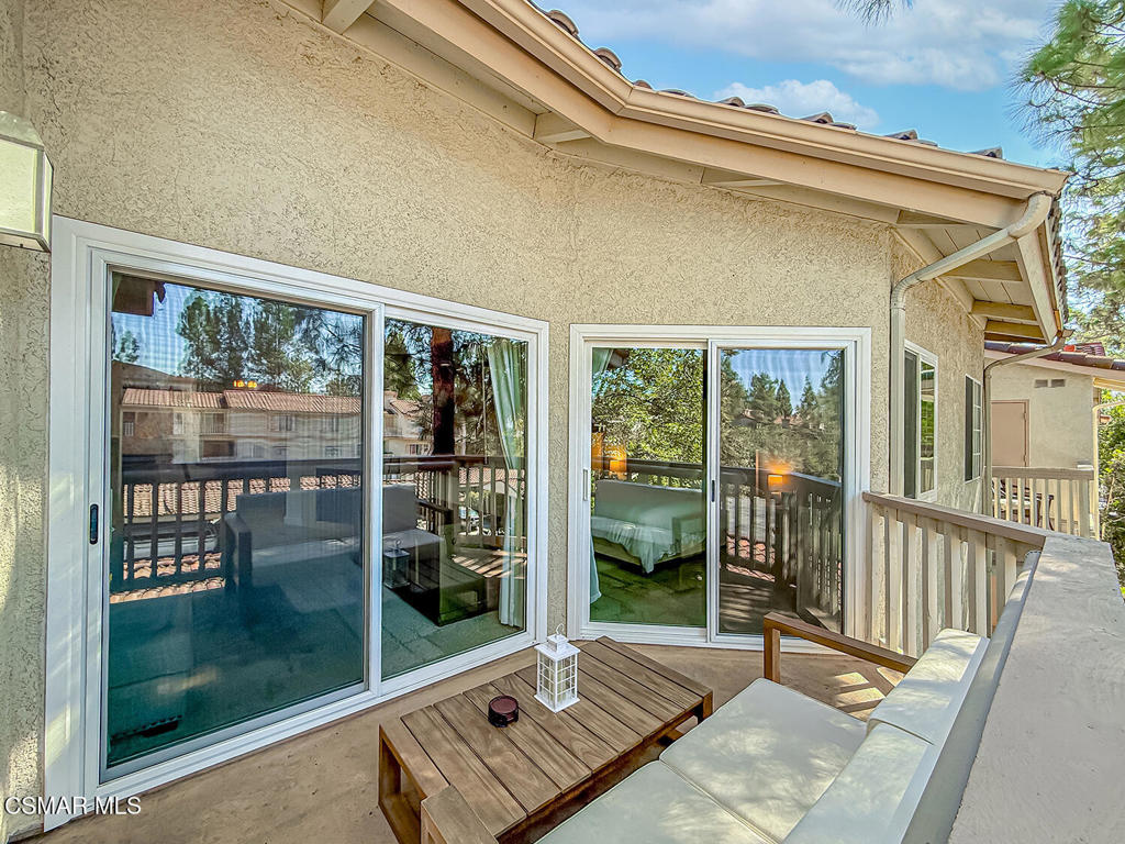 5837 Oak Bend Lane, Unit 302 Oak Park, CA 91377 - Photo 23 of 59 a view of a balcony with floor to ceiling window