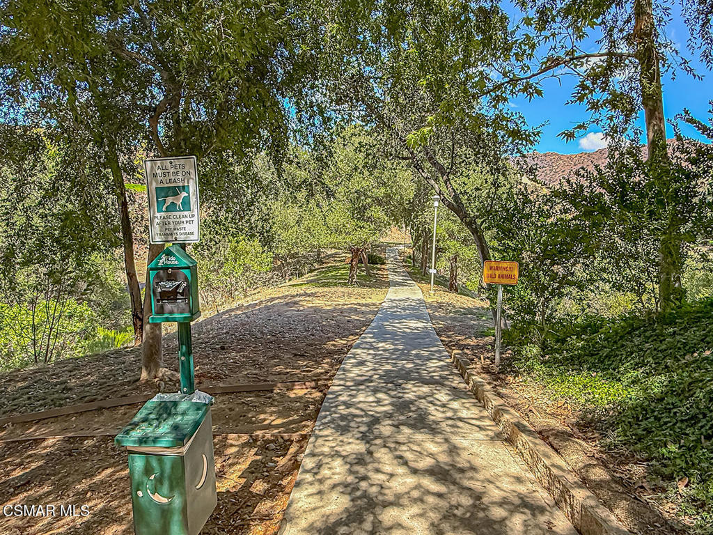 5837 Oak Bend Lane, Unit 302 Oak Park, CA 91377 - Photo 26 of 59 a pathway of a yard