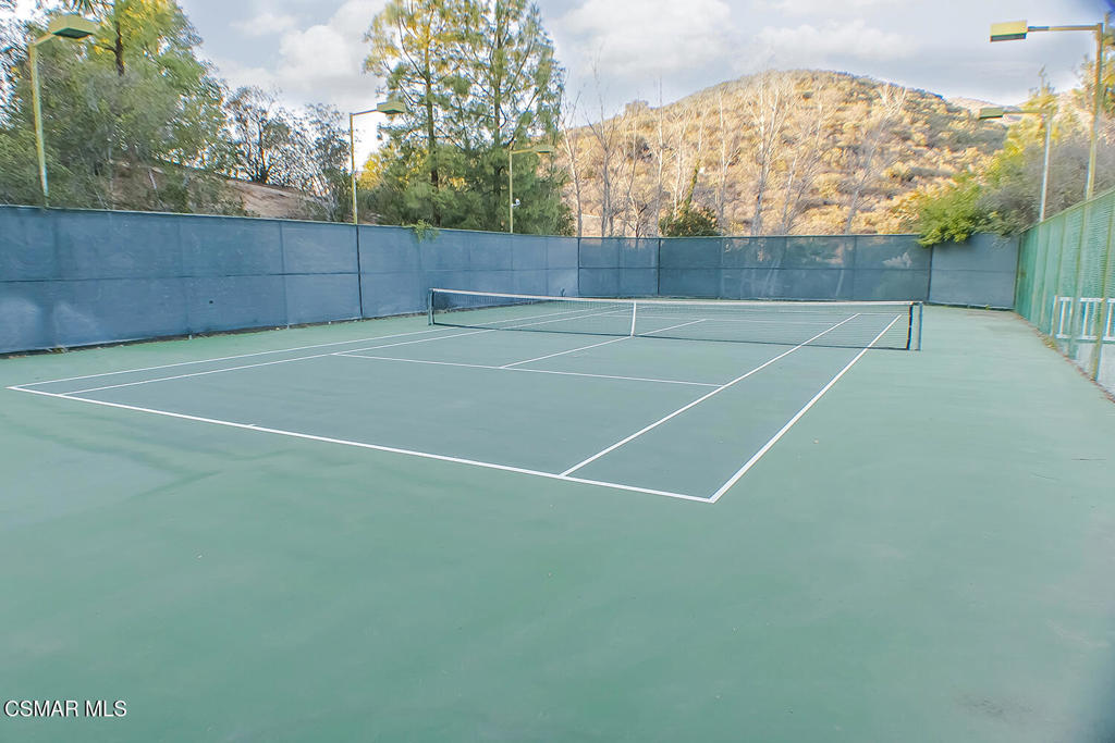 5837 Oak Bend Lane, Unit 302 Oak Park, CA 91377 - Photo 47 of 59 a view of a tennis court