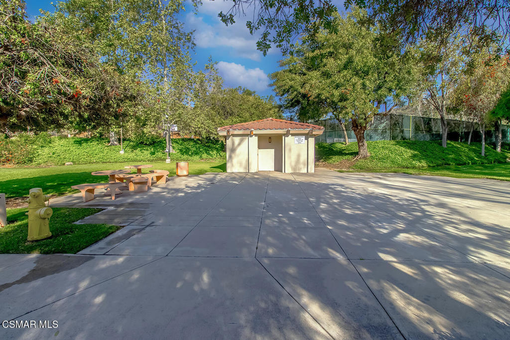 5837 Oak Bend Lane, Unit 302 Oak Park, CA 91377 - Photo 55 of 59 a view of a house with a yard and street