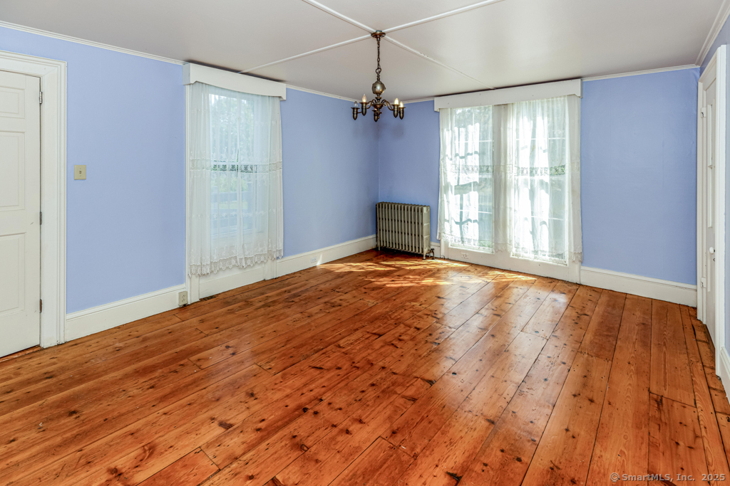 1572 Saybrook Road Haddam, CT 06438 - Photo 34 of 37 a view of an empty room with a window and wooden floor