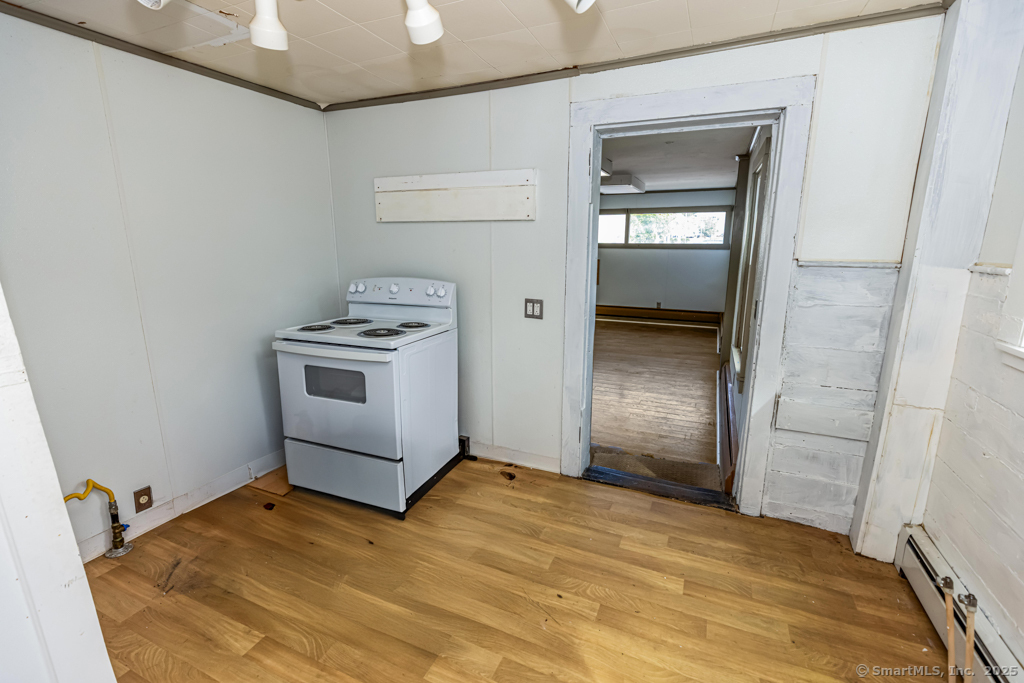 1572 Saybrook Road Haddam, CT 06438 - Photo 7 of 37 a view of a kitchen with a sink and a stove
