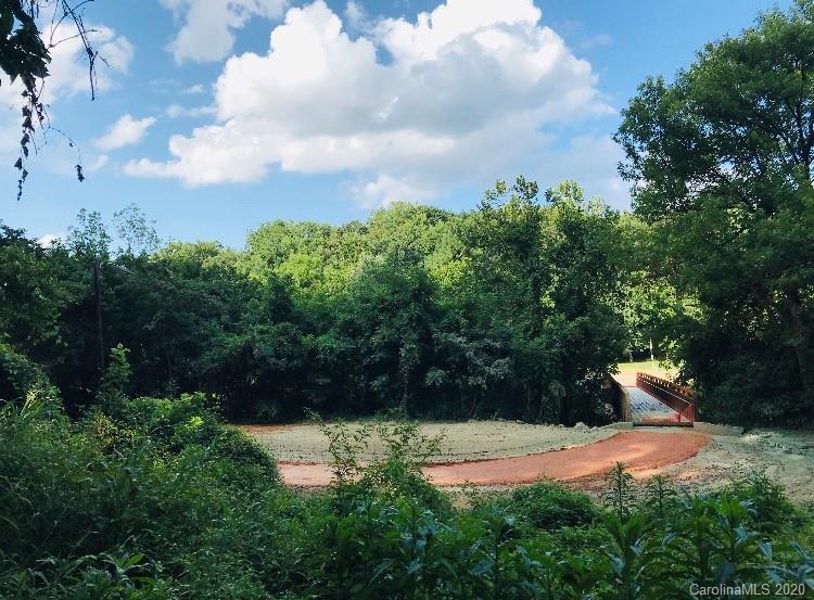 7501 Watercrest Road Charlotte, NC 28210 - Photo 2 of 17 a view of a pathway with a yard