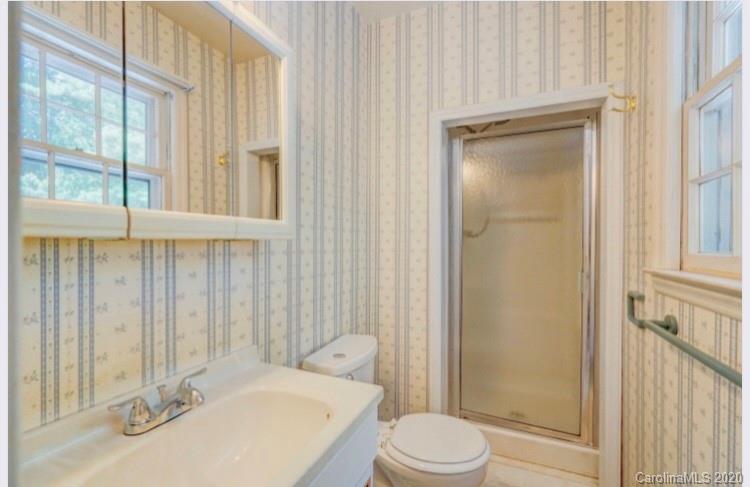 7501 Watercrest Road Charlotte, NC 28210 - Photo 5 of 17 a bathroom with a sink a toilet and shower