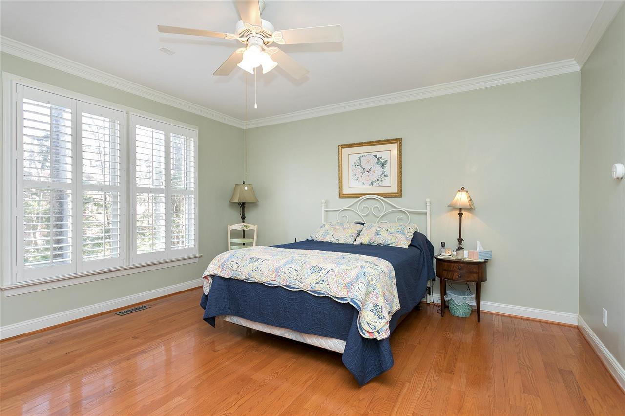 8216 Lloyd Allyns Way Raleigh, NC 27615 - Photo 10 of 30 Hardwood flooring throughout main floor. Nice millwork and plantation shutters. Master Bedroom