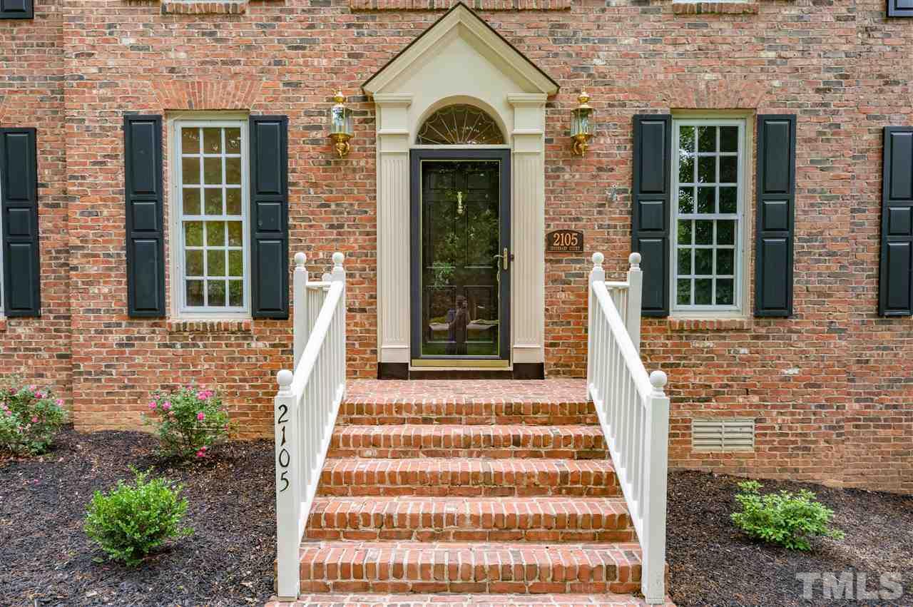 2105 Inverrary Court Raleigh, NC 27615 - Photo 2 of 29 a front view of a house with a garden