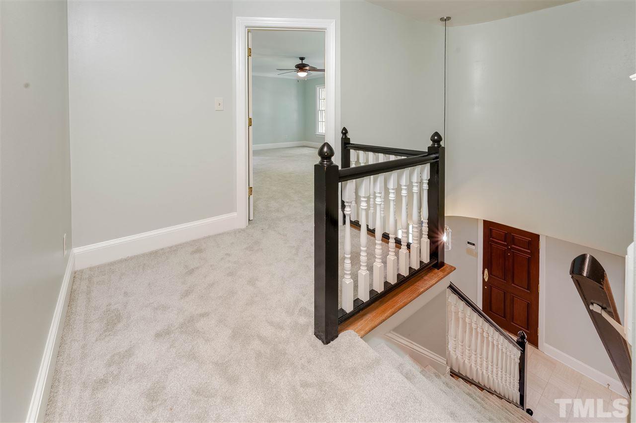 2105 Inverrary Court Raleigh, NC 27615 - Photo 12 of 29 a view of a hallway with staircase