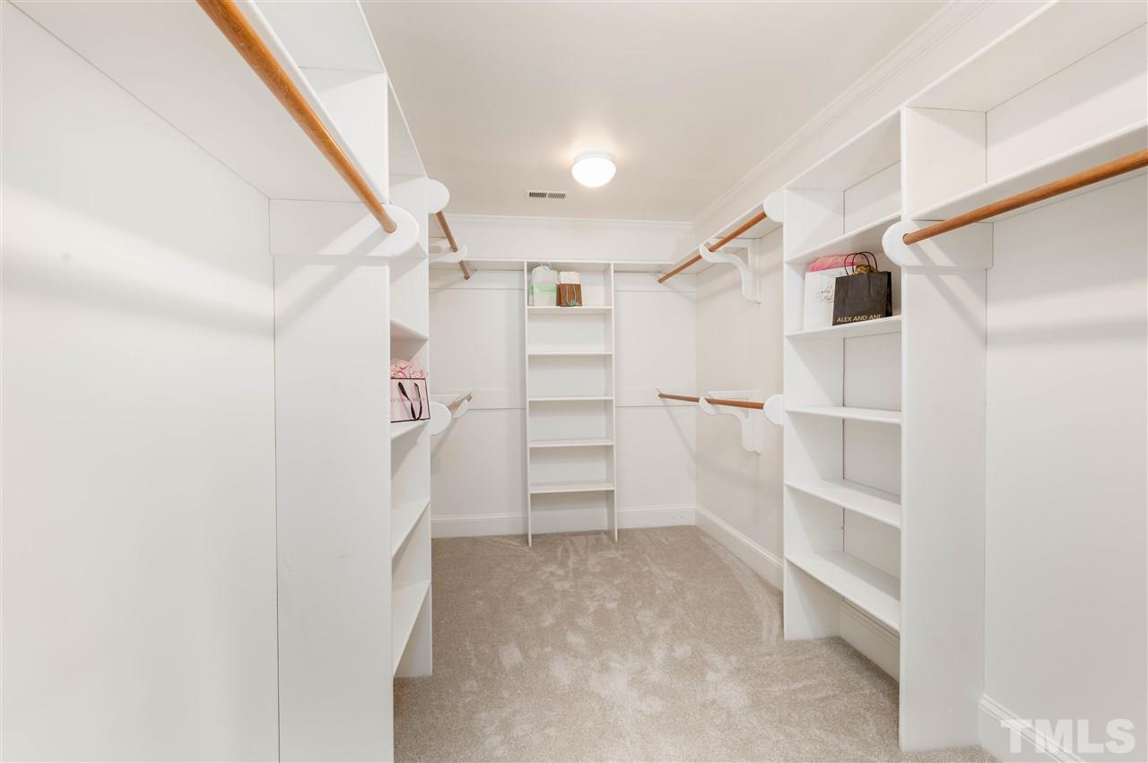 2105 Inverrary Court Raleigh, NC 27615 - Photo 17 of 29 a view of walk in closet with empty racks