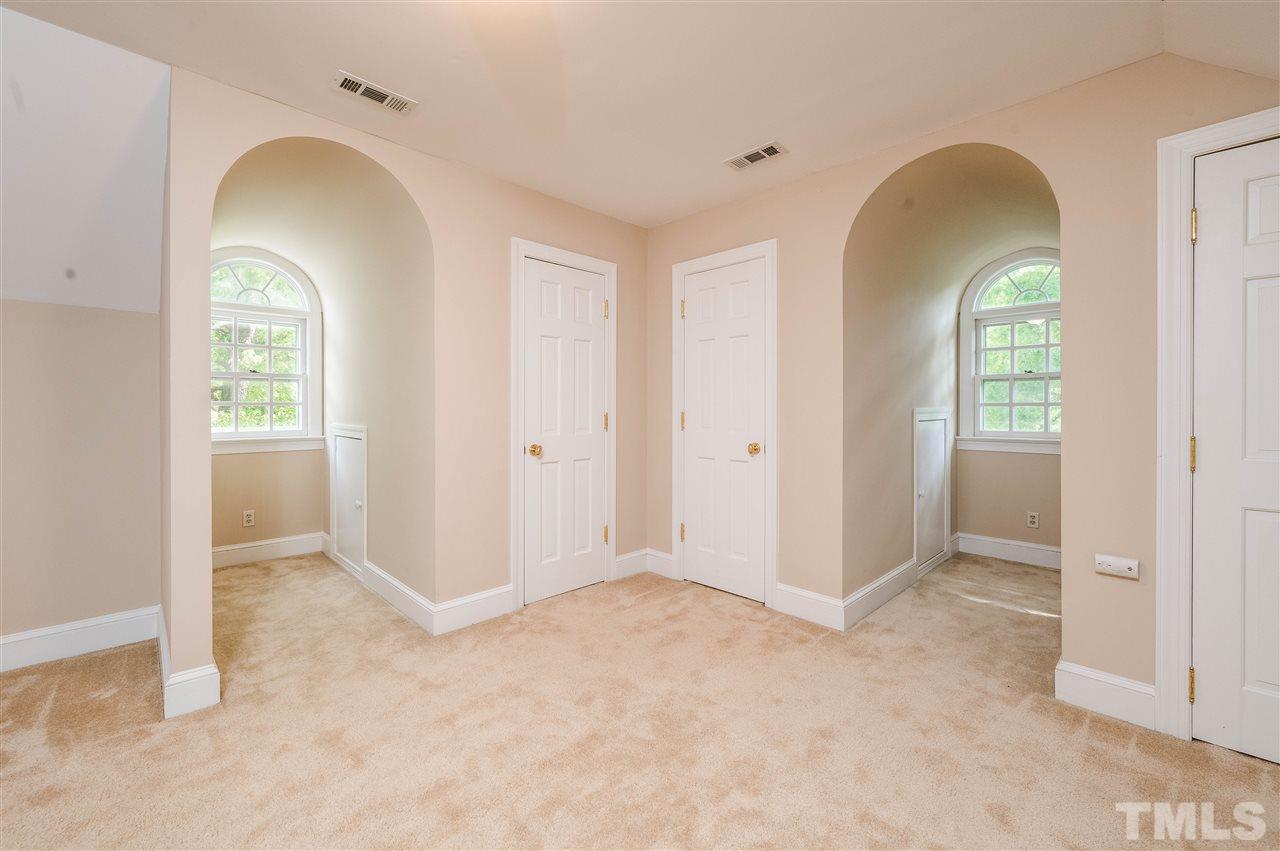 2105 Inverrary Court Raleigh, NC 27615 - Photo 21 of 29 an empty room with windows and mirror