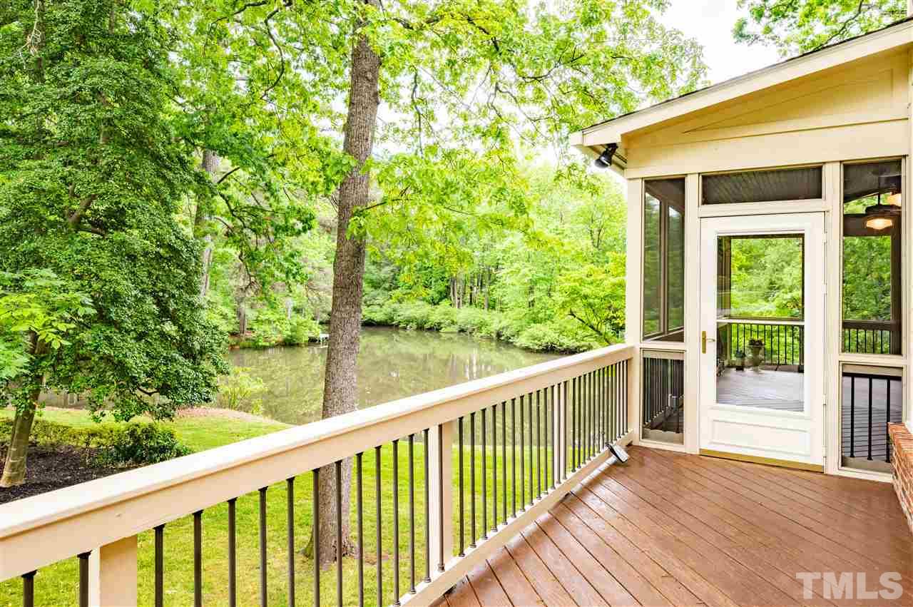2105 Inverrary Court Raleigh, NC 27615 - Photo 24 of 29 a view of a wooden deck next to a yard