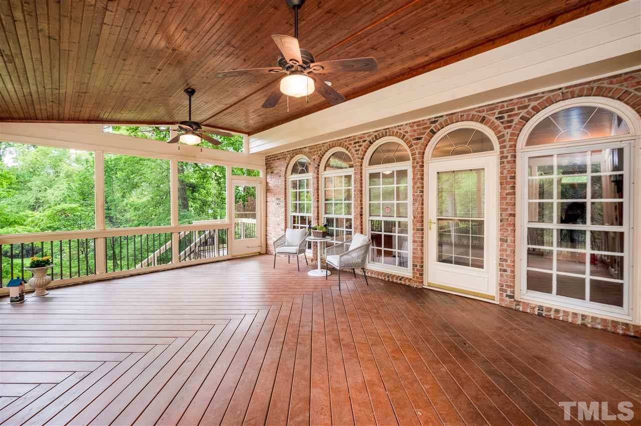 2105 Inverrary Court Raleigh, NC 27615 - Photo 25 of 29 a view of front door with porch and wooden floor