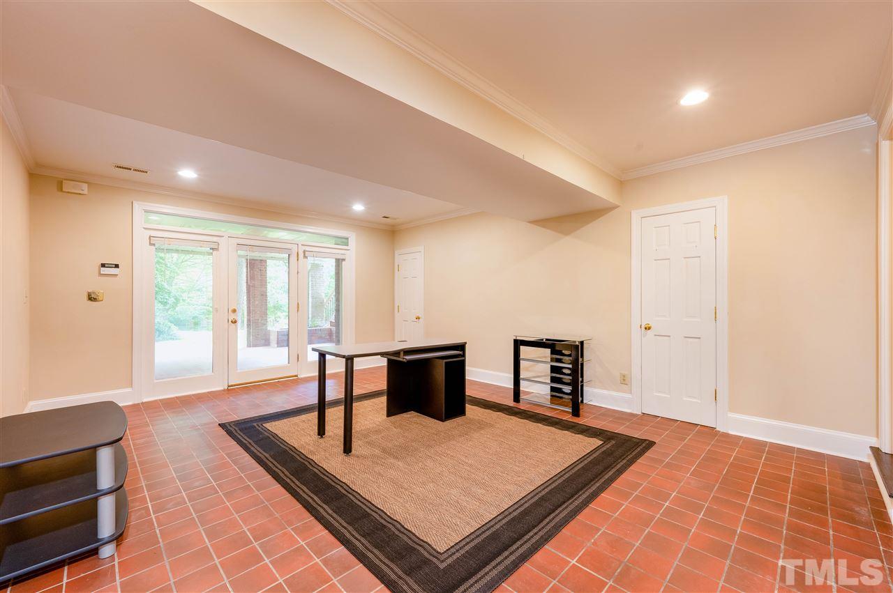 2105 Inverrary Court Raleigh, NC 27615 - Photo 29 of 29 a living room with furniture and a wooden floor