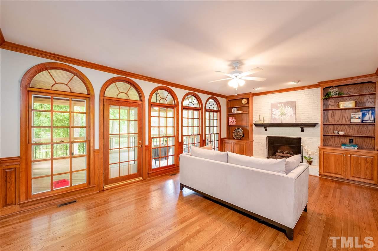 2105 Inverrary Court Raleigh, NC 27615 - Photo 6 of 29 a living room with fireplace furniture and a large window