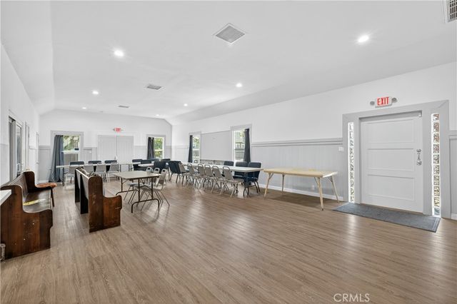 a view of a living room kitchen and dining room