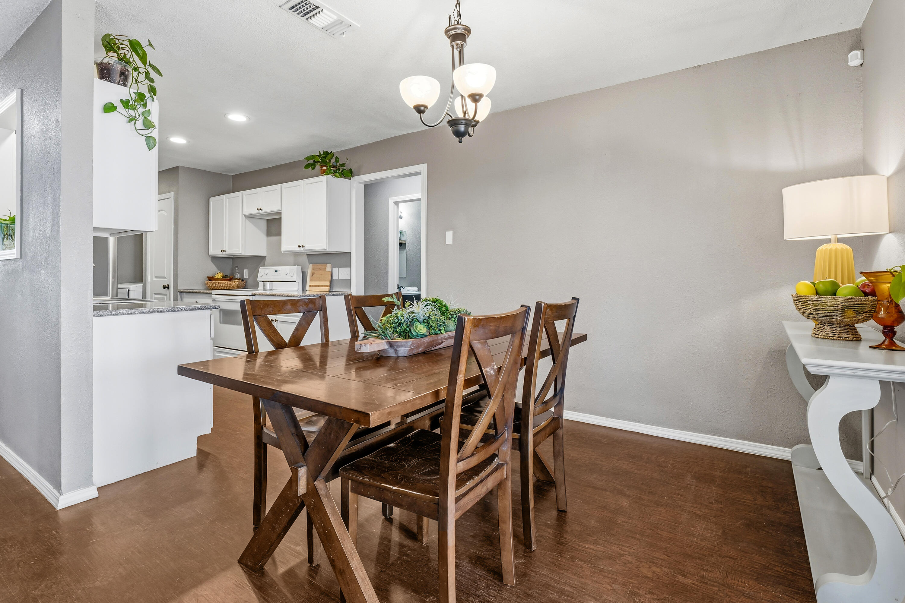 5736 2nd Place Lubbock, TX 79416 - Photo 13 of 26 a view of a dining room with furniture and chandelier
