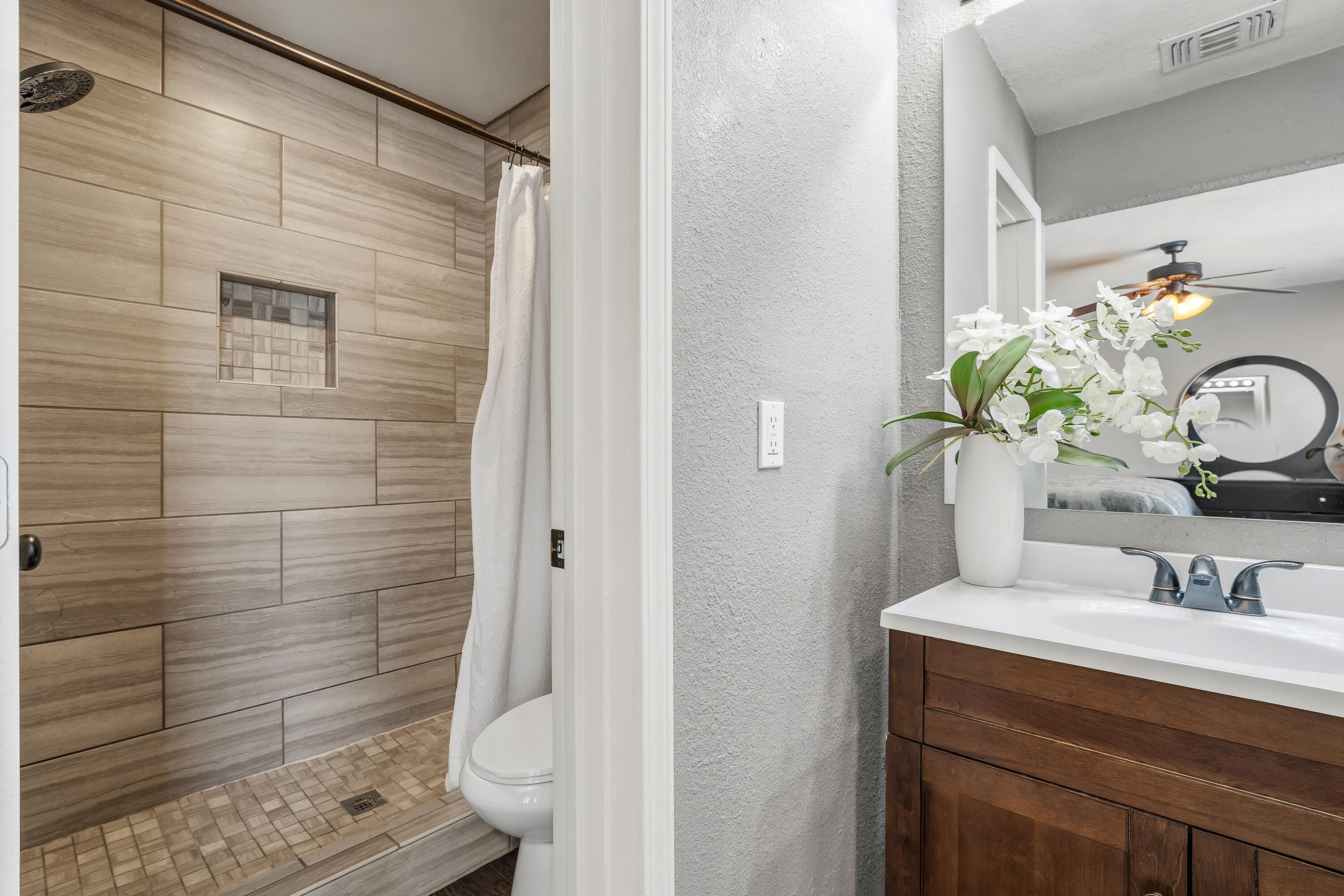 5736 2nd Place Lubbock, TX 79416 - Photo 17 of 26 a bathroom with a sink toilet and shower