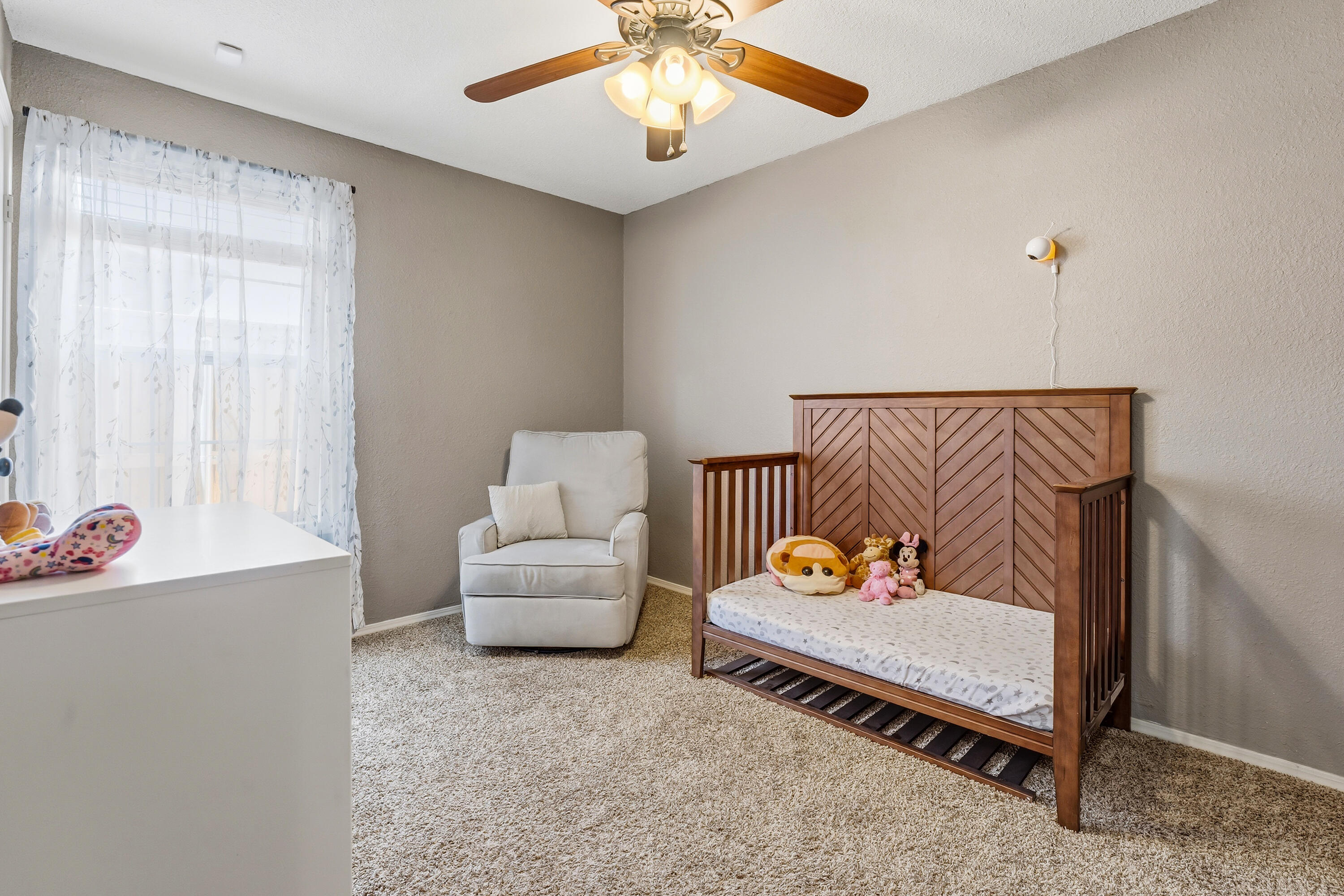 5736 2nd Place Lubbock, TX 79416 - Photo 19 of 26 a living room with furniture and a window