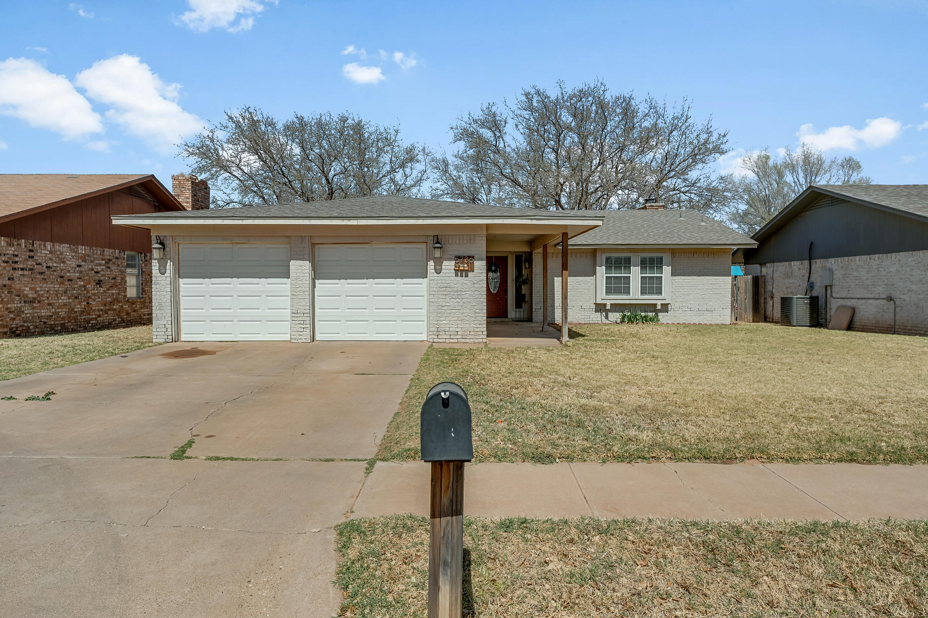 5736 2nd Place Lubbock, TX 79416 - Photo 2 of 26 a front view of a house with garden