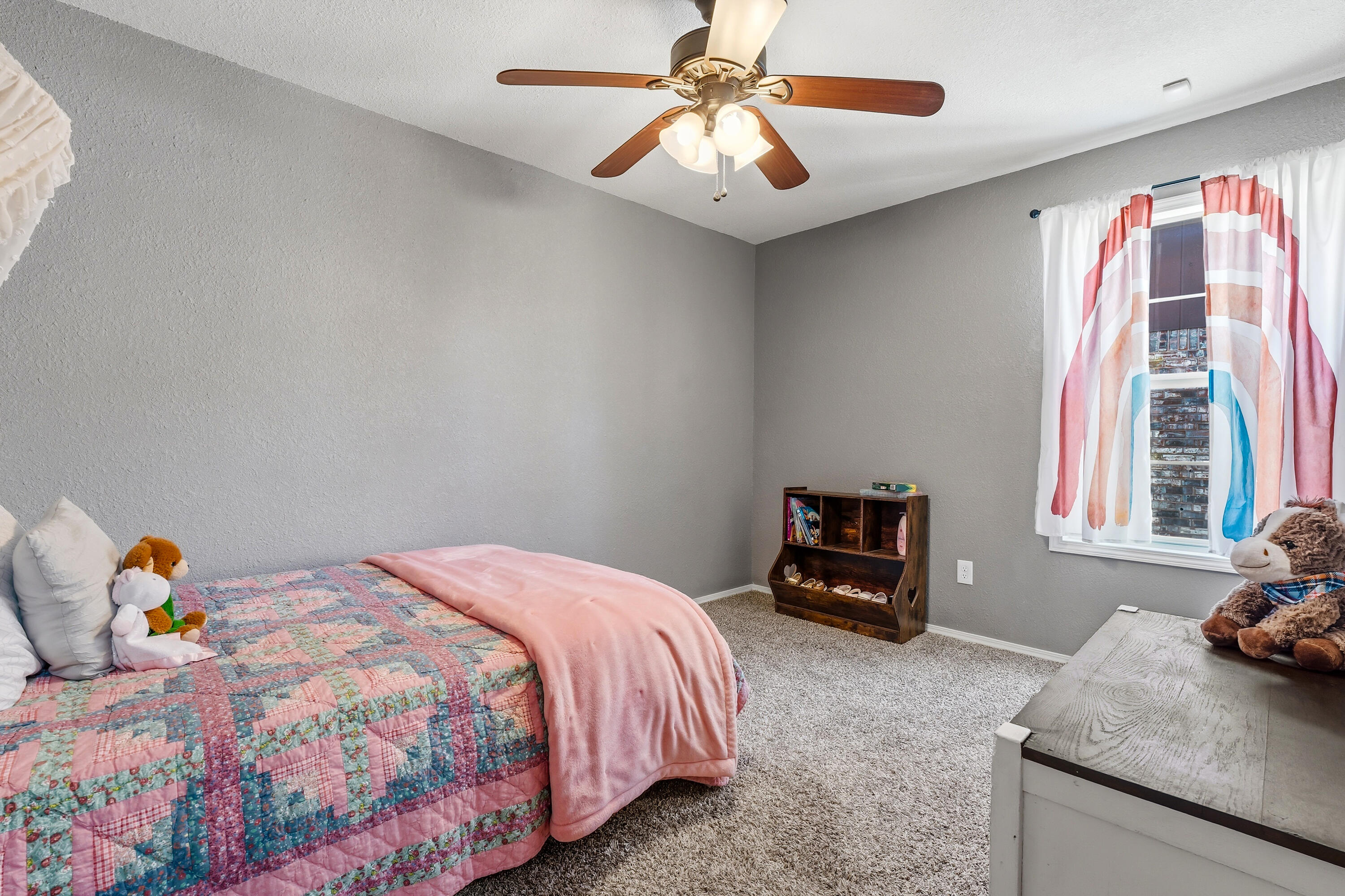 5736 2nd Place Lubbock, TX 79416 - Photo 23 of 26 a bedroom with a bed and a window