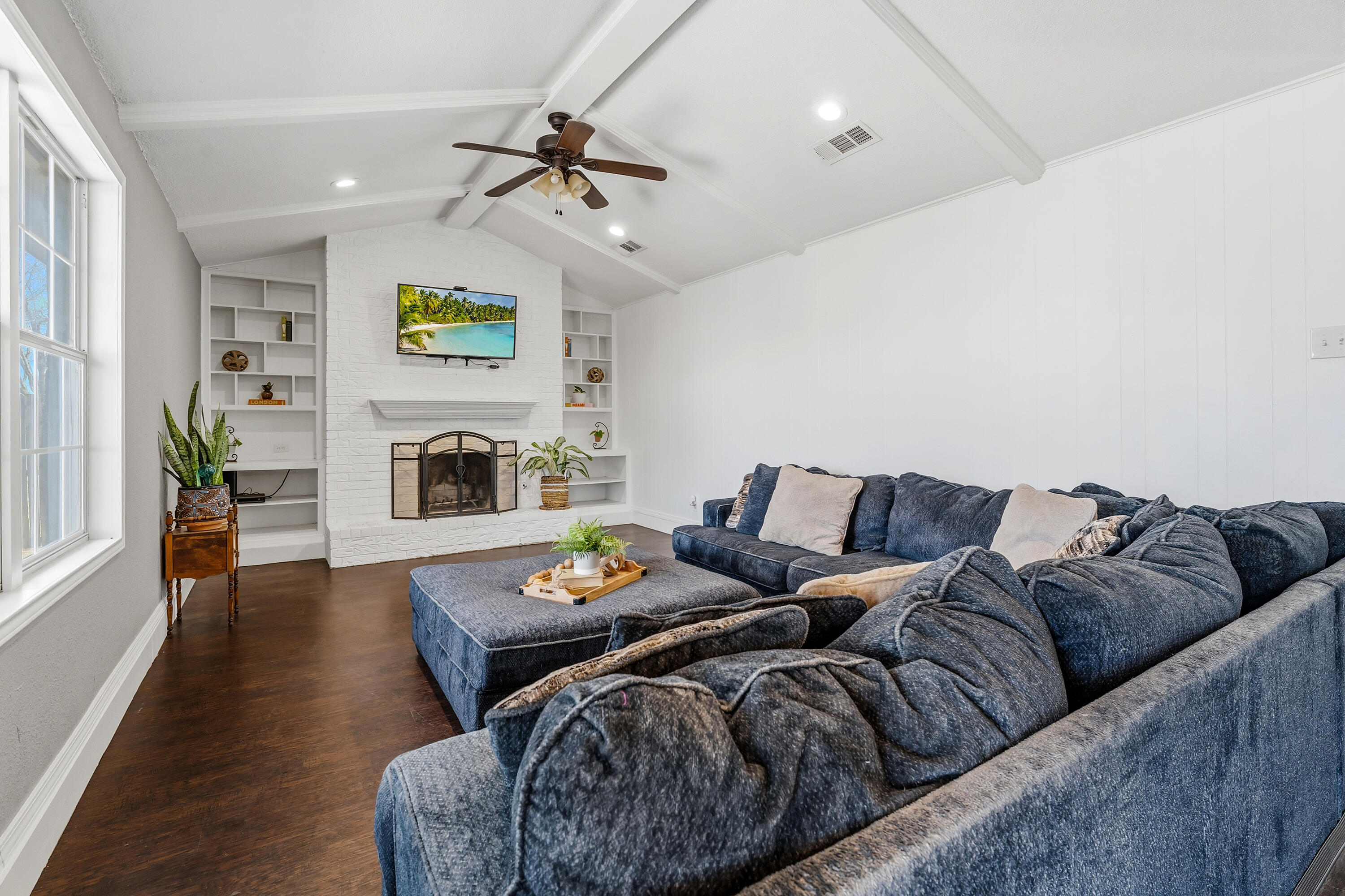5736 2nd Place Lubbock, TX 79416 - Photo 7 of 26 a living room with furniture and a fireplace