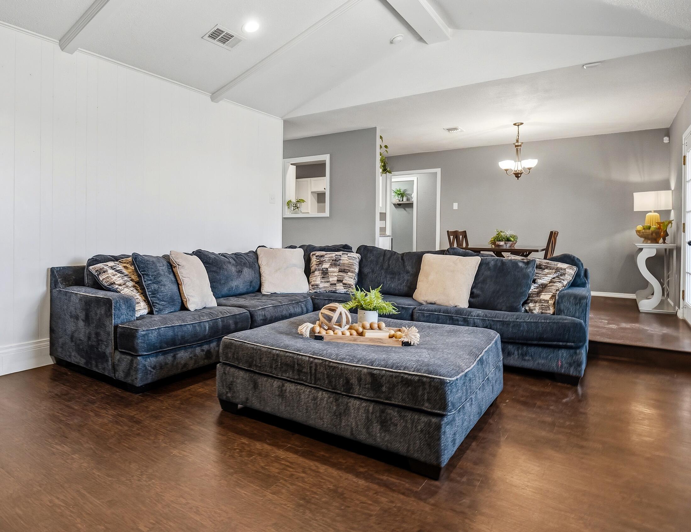 5736 2nd Place Lubbock, TX 79416 - Photo 9 of 26 a living room with furniture and a couch