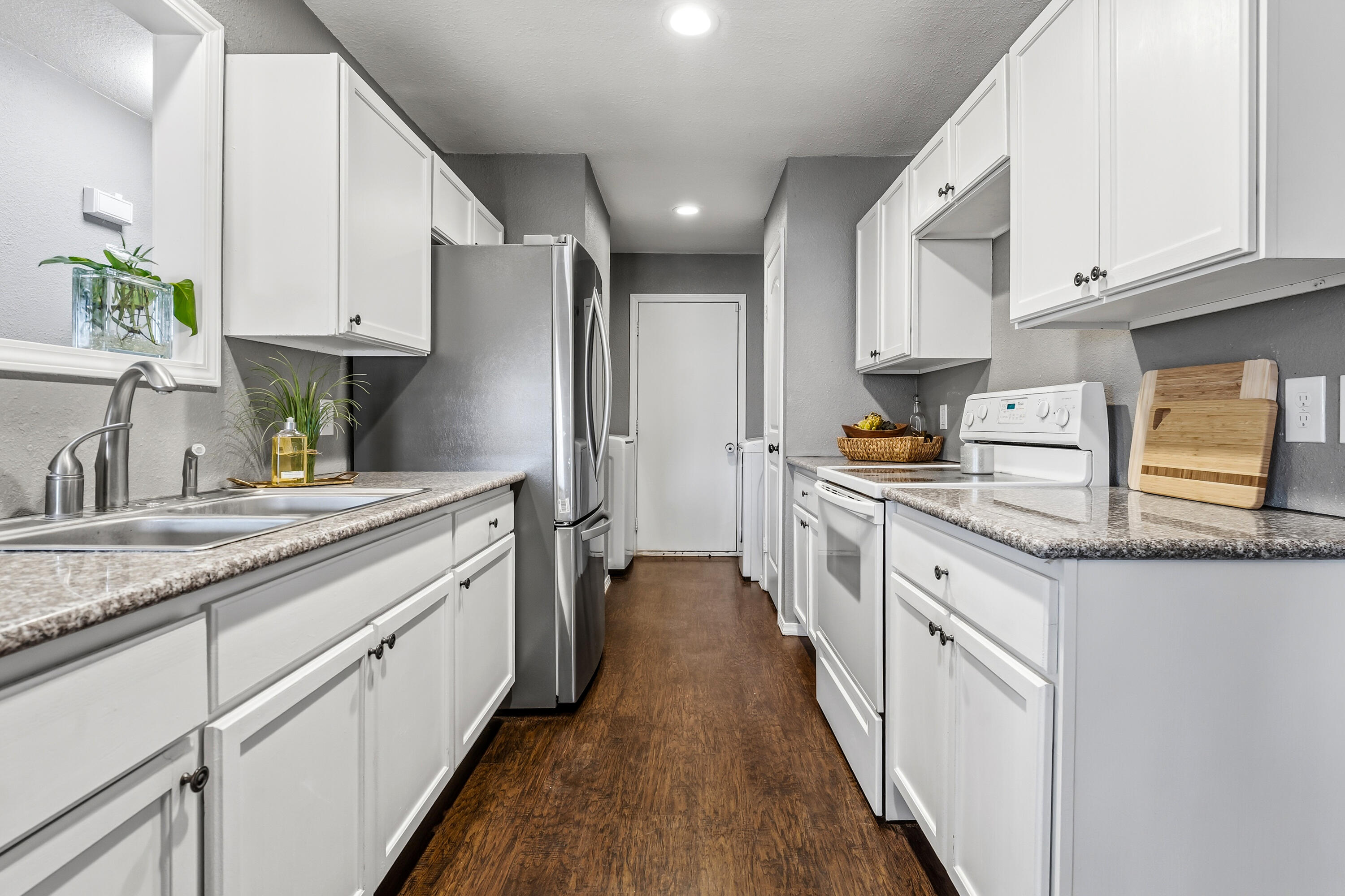 5736 2nd Place Lubbock, TX 79416 - Photo 10 of 26 a kitchen with cabinets and a sink
