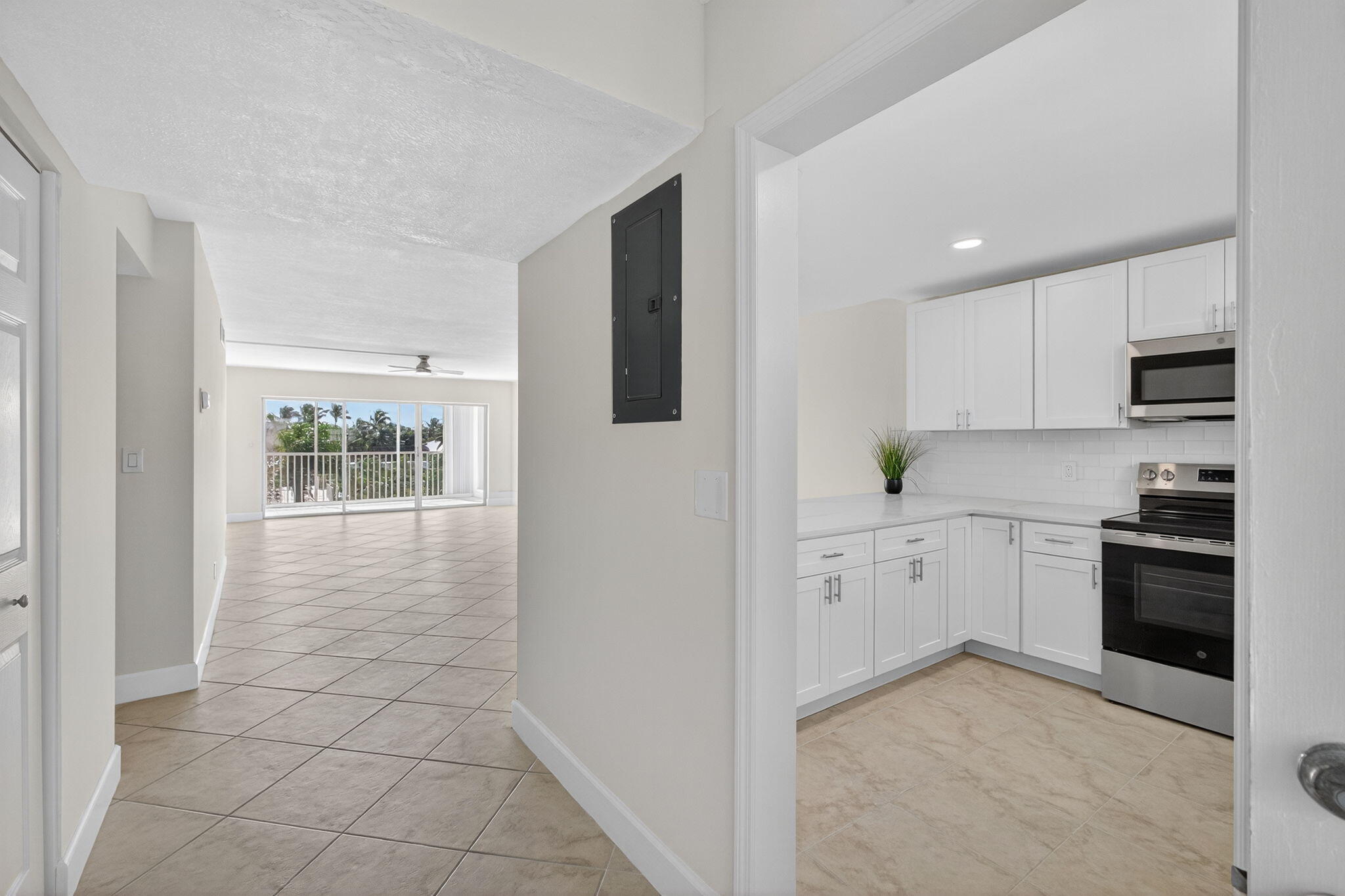 100 Waterway Road, Unit A304 Tequesta, FL 33469 - Photo 12 of 90 a kitchen with stainless steel appliances granite countertop a stove a sink and a refrigerator