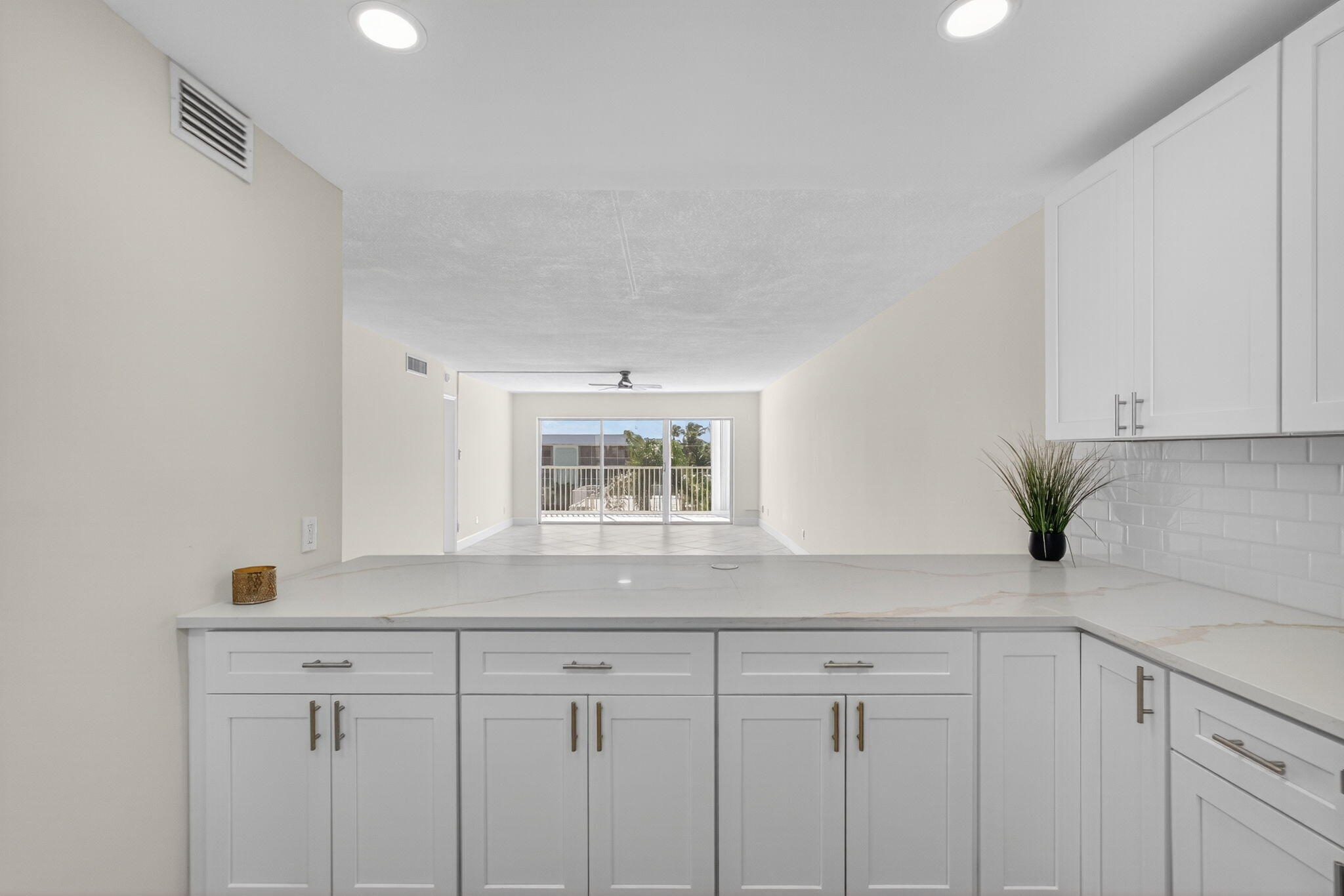 100 Waterway Road, Unit A304 Tequesta, FL 33469 - Photo 20 of 90 a kitchen with a sink and cabinets