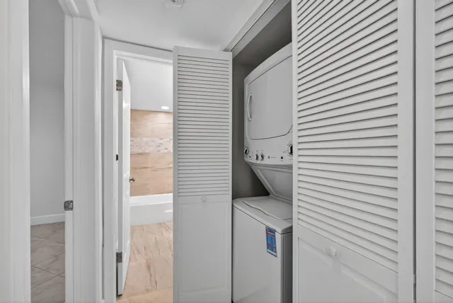 a kitchen with a stove a sink and a cabinets