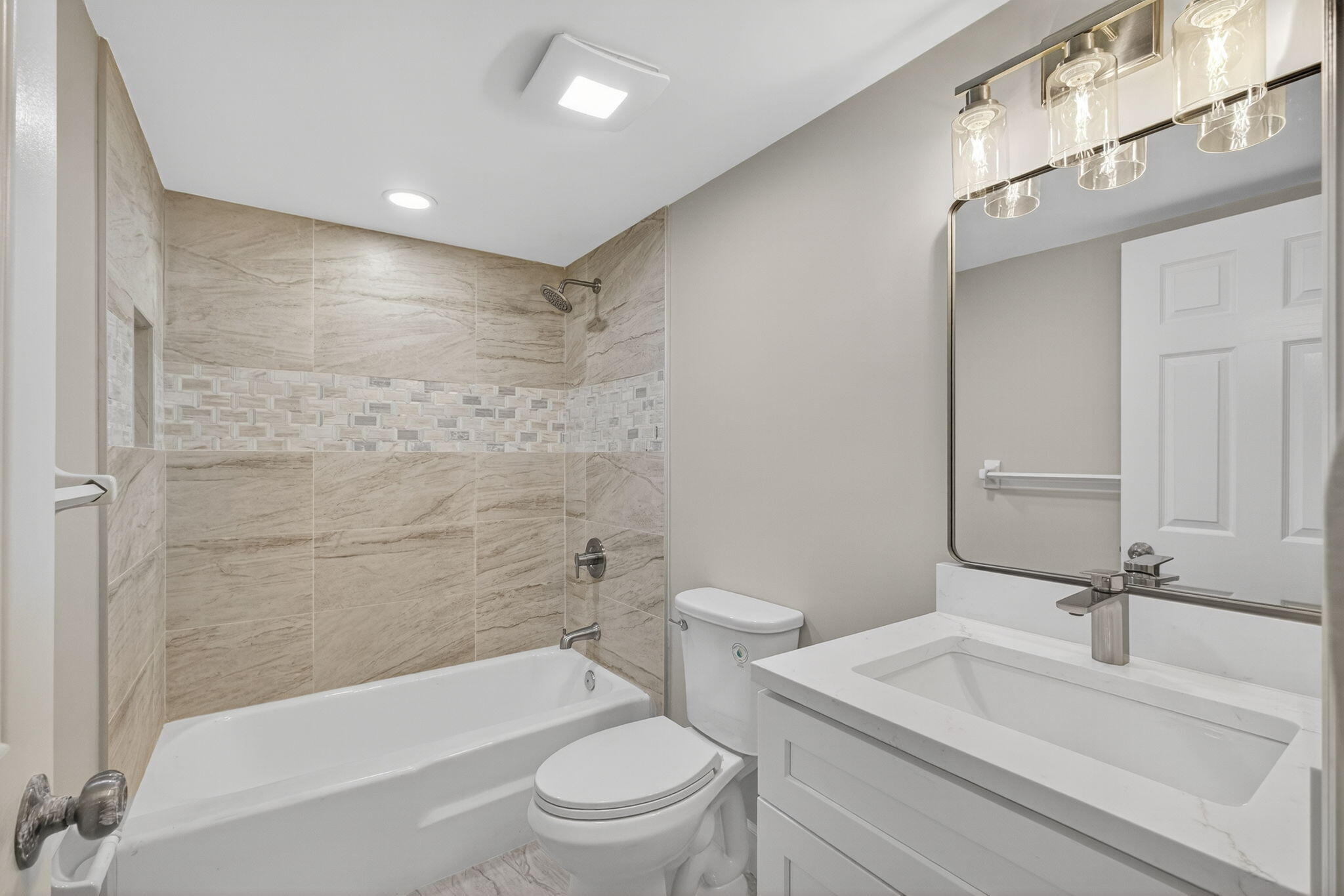 100 Waterway Road, Unit A304 Tequesta, FL 33469 - Photo 35 of 90 a bathroom with a bathtub shower sink mirror vanity and toilet