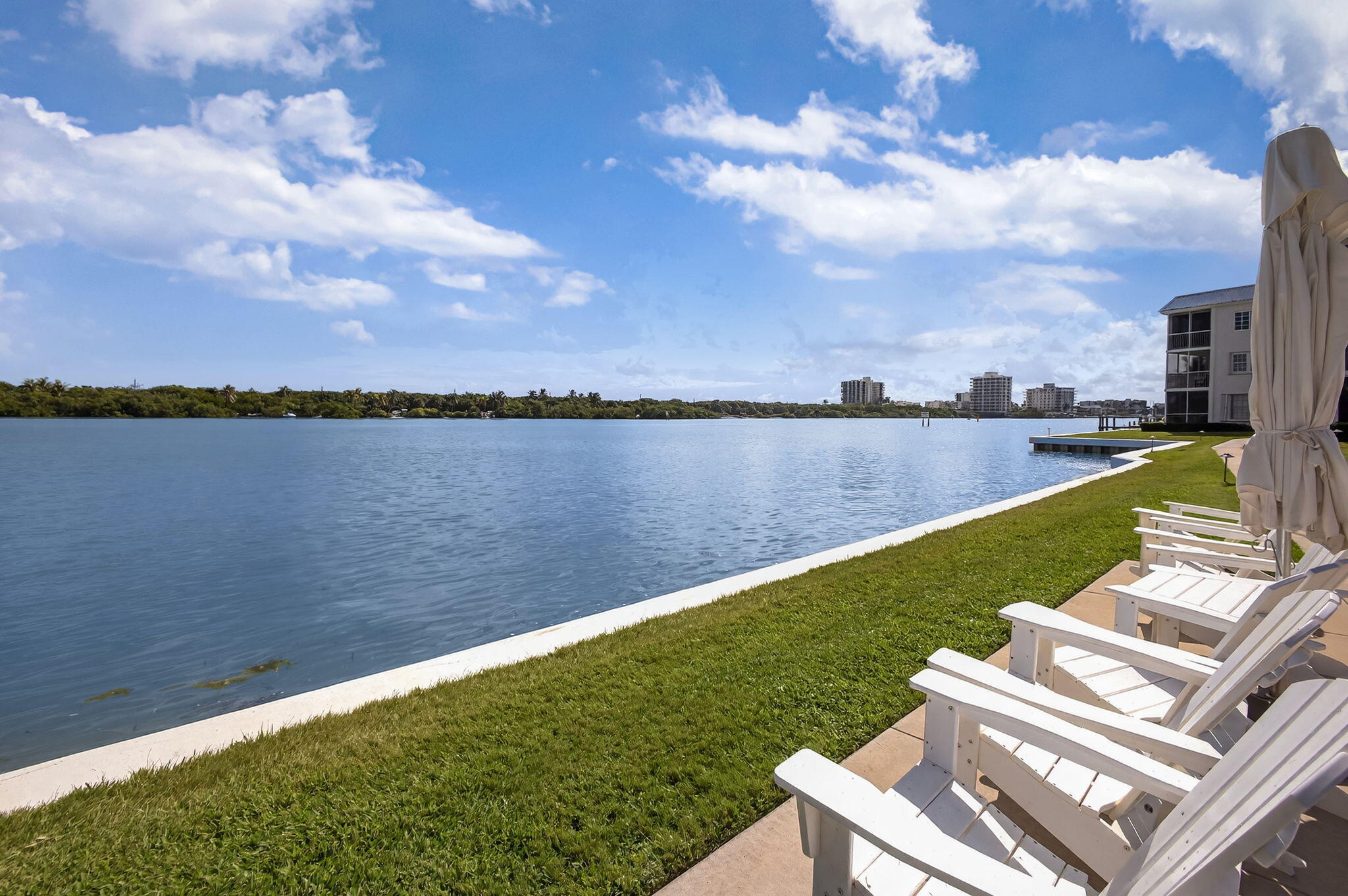 100 Waterway Road, Unit A304 Tequesta, FL 33469 - Photo 67 of 90 a view of a lake with houses in the back