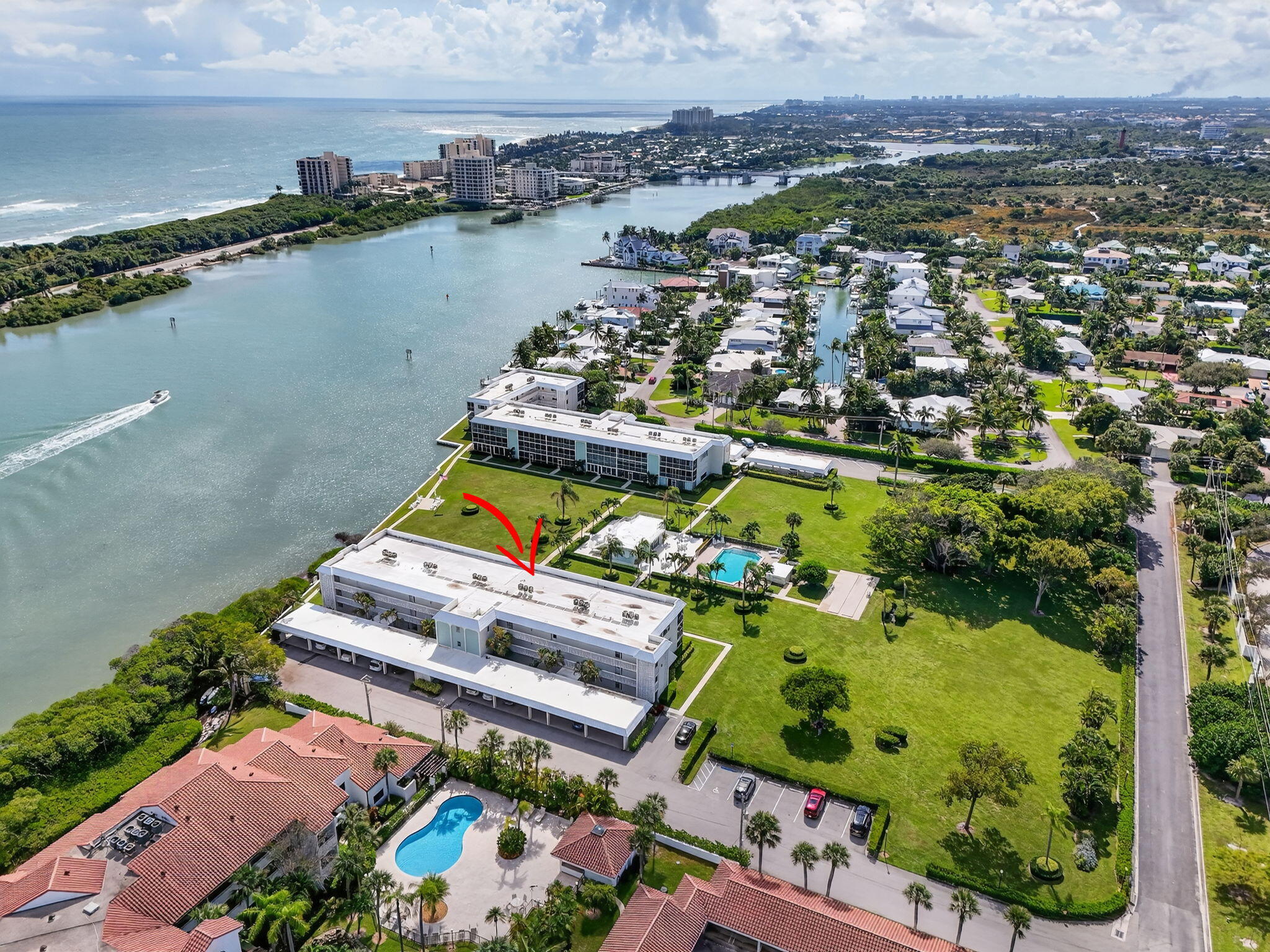 100 Waterway Road, Unit A304 Tequesta, FL 33469 - Photo 82 of 90 an aerial view of house with yard swimming pool and outdoor seating