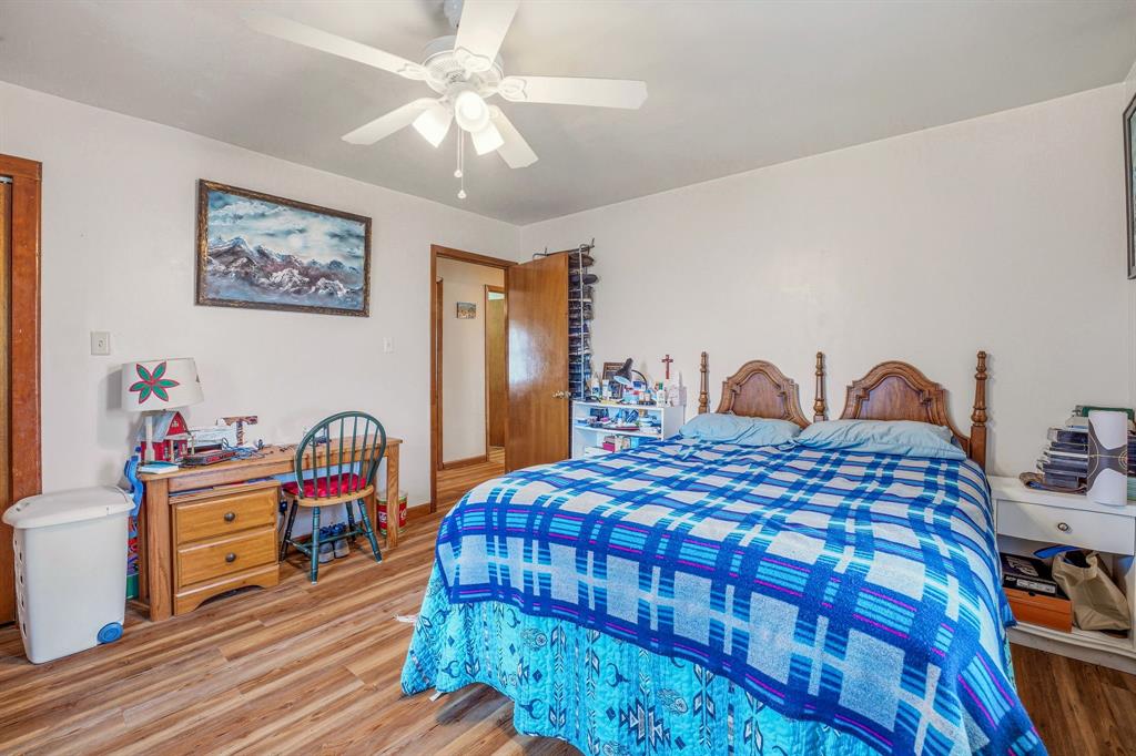 941 Farm To Market 1287 Graham, TX 76450 - Photo 11 of 39 a bedroom with a bed and a chandelier