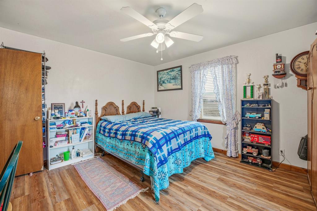 941 Farm To Market 1287 Graham, TX 76450 - Photo 12 of 39 a bedroom with a bed and a chandelier