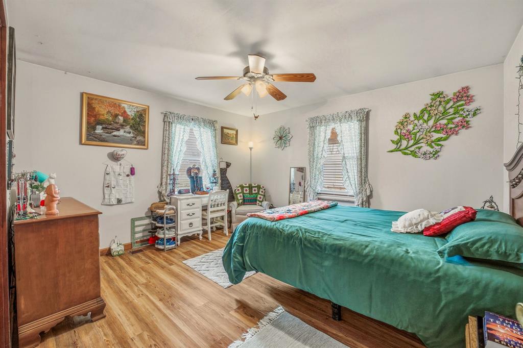 941 Farm To Market 1287 Graham, TX 76450 - Photo 14 of 39 a bedroom with a bed and a chandelier