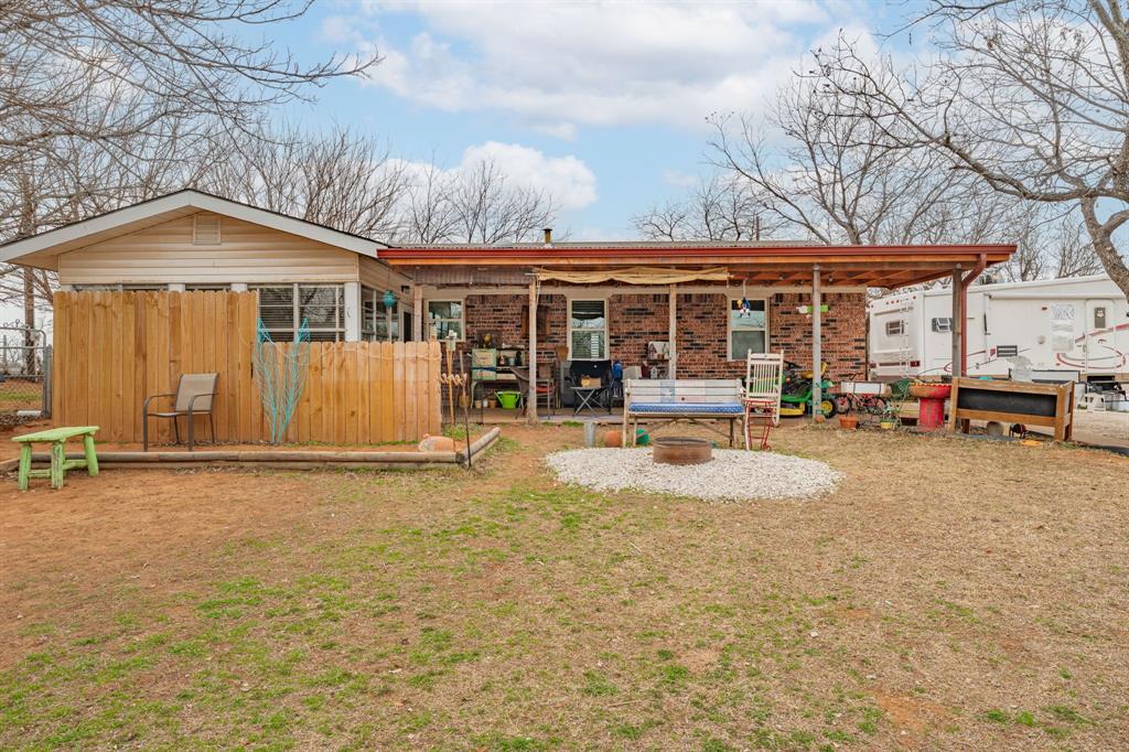 941 Farm To Market 1287 Graham, TX 76450 - Photo 19 of 39 a front view of a house with basket ball court and barbeque oven