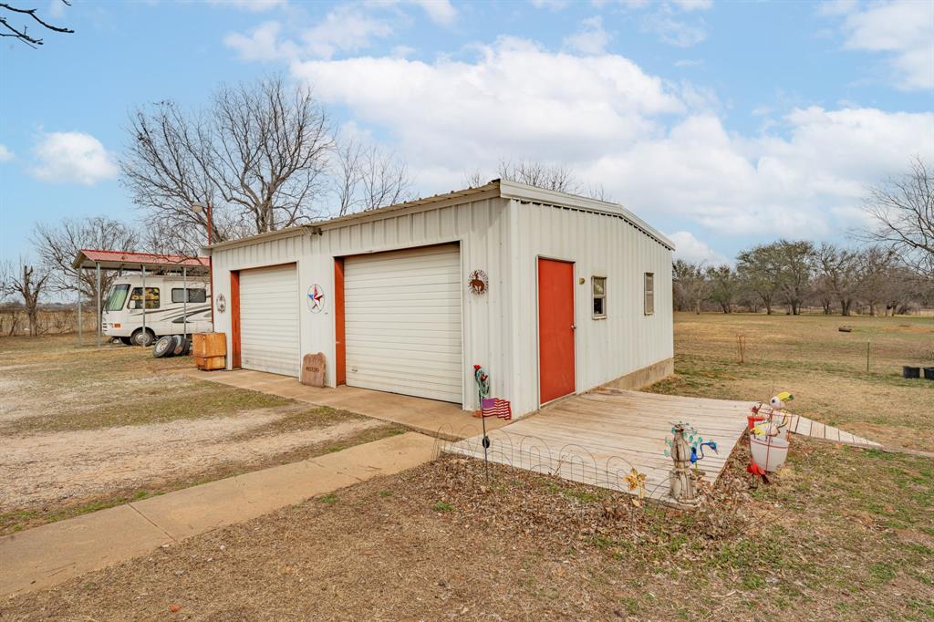 941 Farm To Market 1287 Graham, TX 76450 - Photo 20 of 39 a front view of a house with a yard