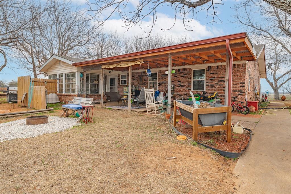 941 Farm To Market 1287 Graham, TX 76450 - Photo 23 of 39 a view of a house with backyard porch and sitting area