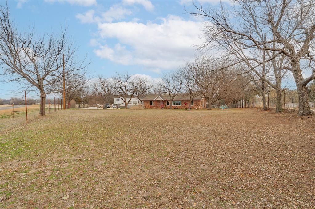 941 Farm To Market 1287 Graham, TX 76450 - Photo 37 of 39 a street view with large trees