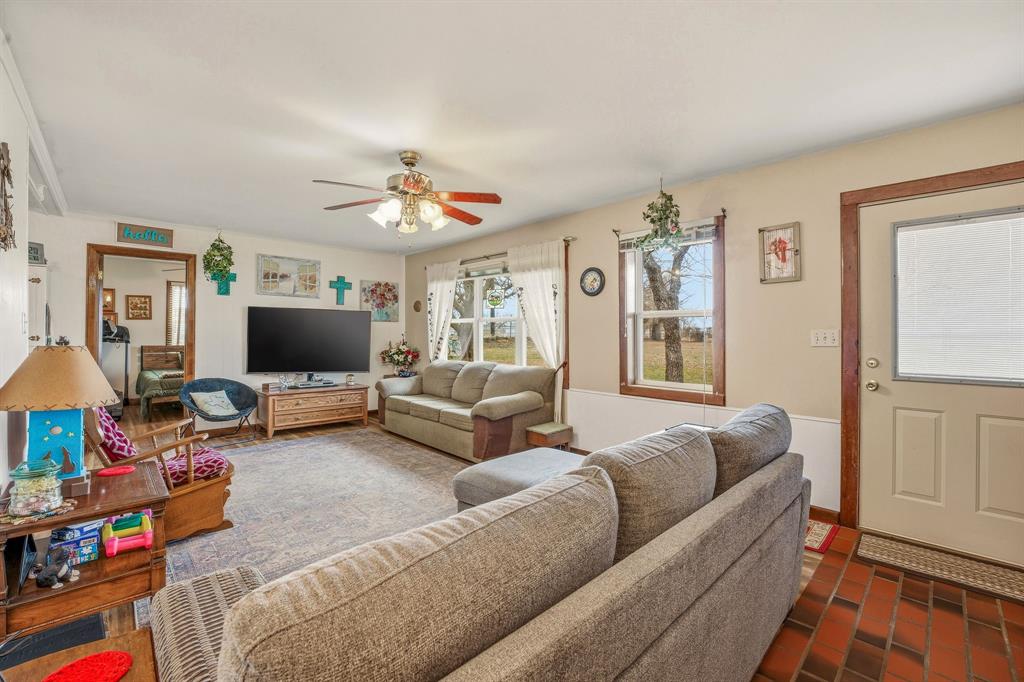 941 Farm To Market 1287 Graham, TX 76450 - Photo 6 of 39 a living room with furniture and a flat screen tv