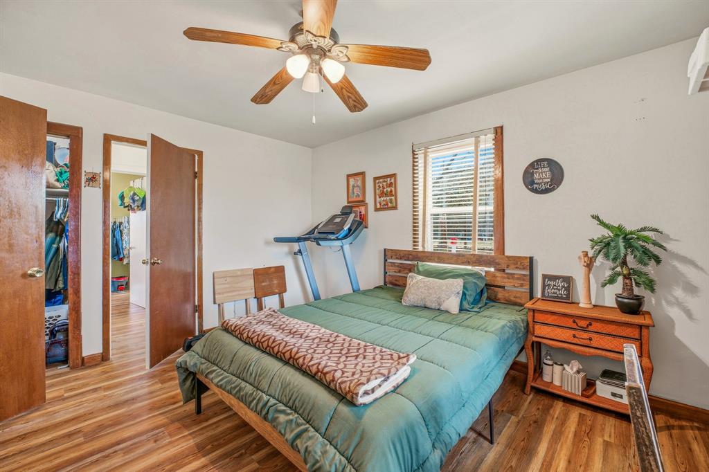 941 Farm To Market 1287 Graham, TX 76450 - Photo 9 of 39 a bedroom with a bed and a chandelier